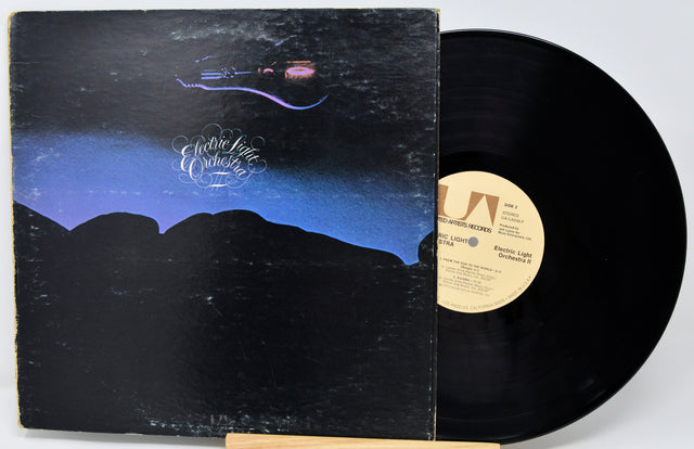 Vinyl record with cover featuring a mountain landscape and 'Electric Light Orchestra' branding.
