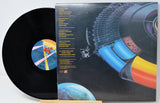 Vinyl record with a colorful space-themed cover and sleeve