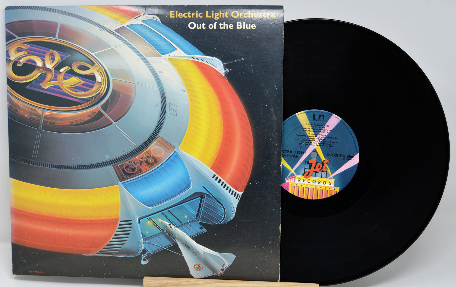 Vinyl record with cover featuring Electric Light Orchestra's 'Out of the Blue' album design.
