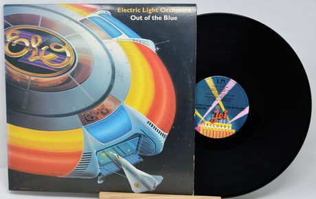 Vinyl record with cover featuring Electric Light Orchestra's 'Out of the Blue' album design.