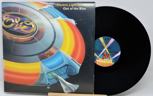 Vinyl record with cover featuring Electric Light Orchestra's 'Out of the Blue' album design.