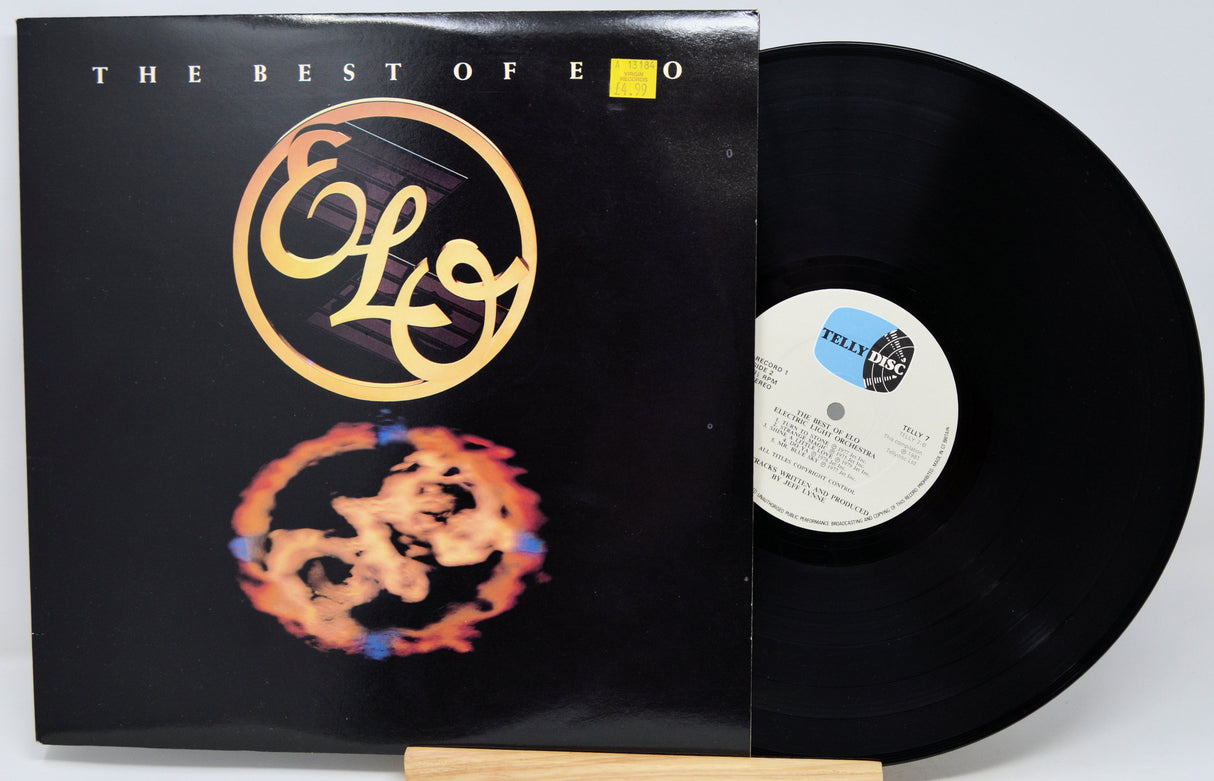 Elvis 'The Best of Elvis' vinyl record album with the black LP record partially pulled from the sleeve, shown on a light gray background.