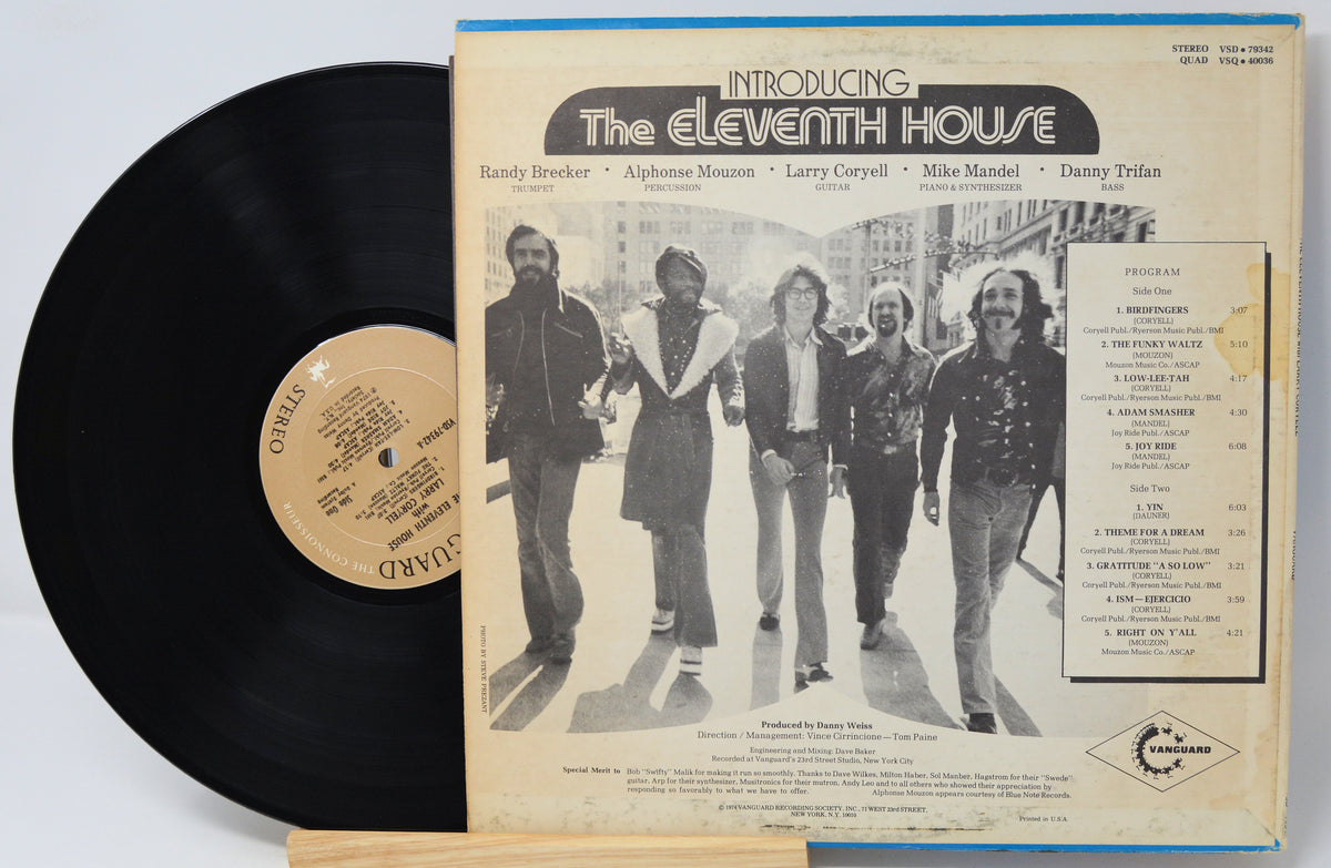 A vintage vinyl record album for 'Introducing The Eleventh House' by The Sound of New York, showing the black LP record partially pulled from the cream-colored sleeve with a band photo and tracklist.