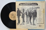 A vintage vinyl record album for 'Introducing The Eleventh House' by The Sound of New York, showing the black LP record partially pulled from the cream-colored sleeve with a band photo and tracklist.