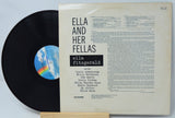 Vinyl record with cover featuring text about Ella Fitzgerald and her band members.