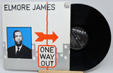 Vinyl record with 'Elmore James One Way Out' cover featuring a portrait and arrow design.