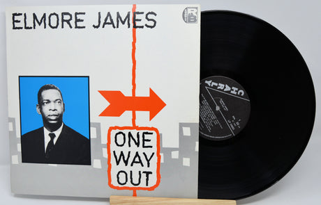 Vinyl record with 'Elmore James One Way Out' cover featuring a portrait and arrow design.
