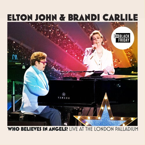 Elton John and Brandi Carlile performing together live at the London Palladium with piano and star decor