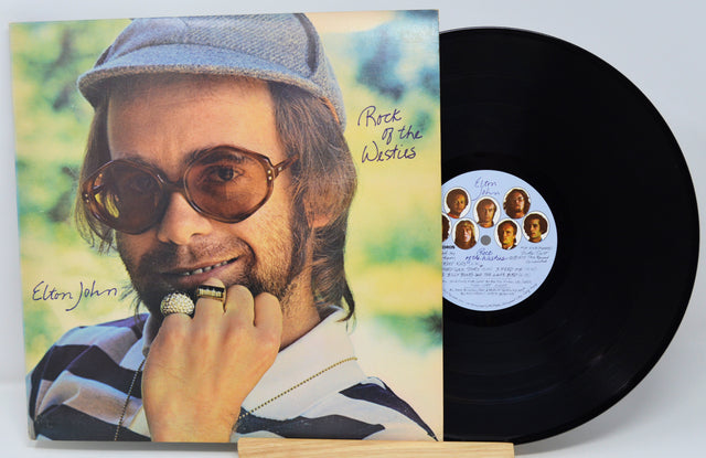 Vinyl record with cover featuring a man's face and album details