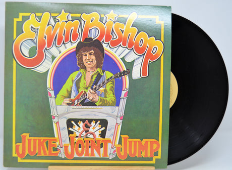 Vinyl record with a colorful cover featuring a person playing guitar, titled 'Juke Joint Jump' by Elvin Bishop.