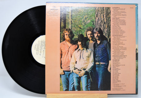 Vinyl record 'Elvin Bishop Let It Flow'  with a cover featuring a group of people outdoors.