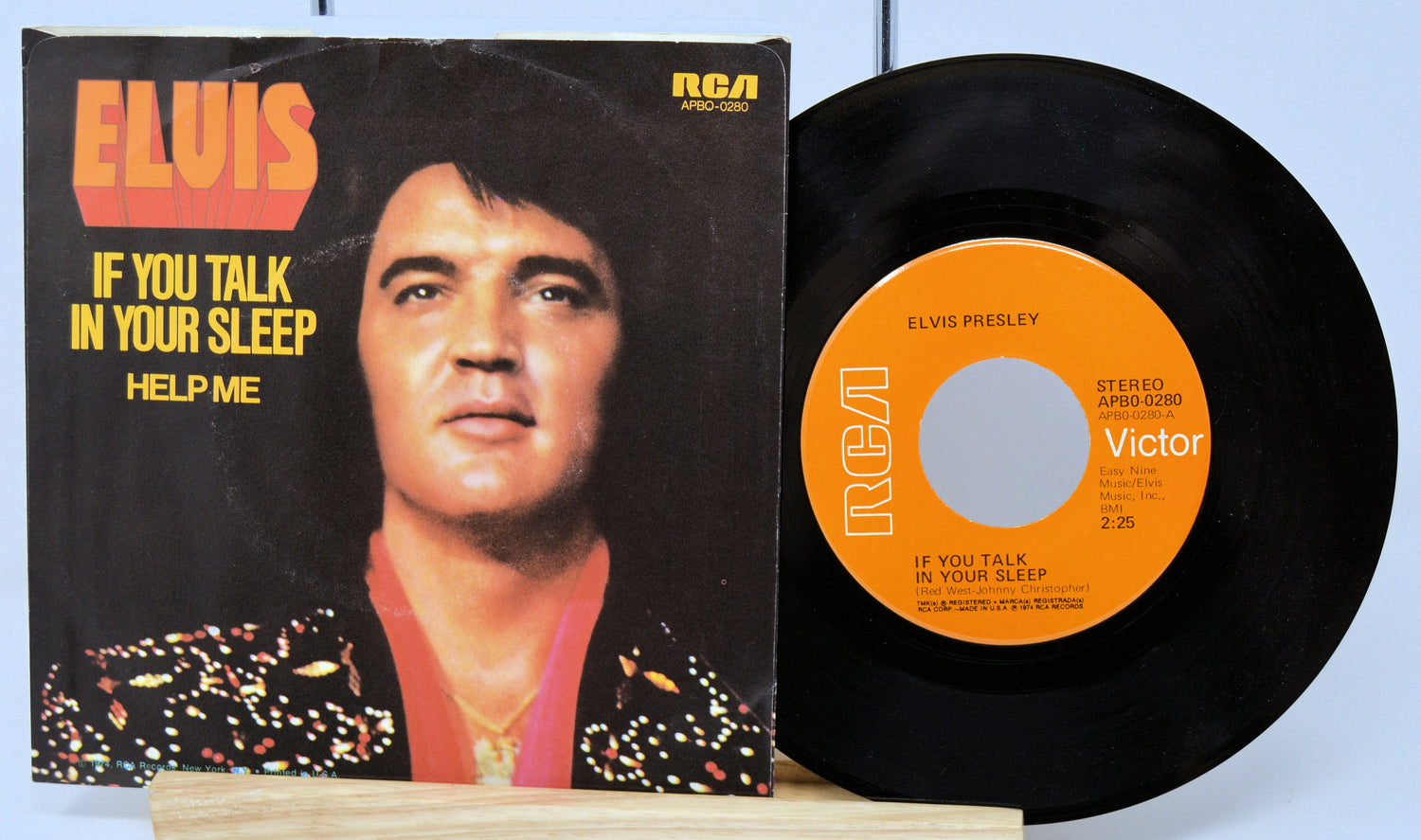 Elvis Presley 45 RPM vinyl record and cover for 'If You Talk In Your Sleep' and 'Help Me'