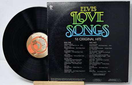 Vinyl record with 'Elvis Love Songs' album cover on a white background