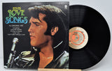Vinyl record with cover featuring Elvis Presley and album details on a white background