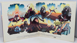 Colorful album cover with artistic illustrations of people and animals against a sunset sky.