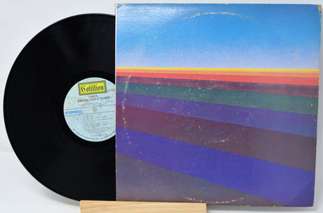 Vinyl record with a colorful cover on a white background
