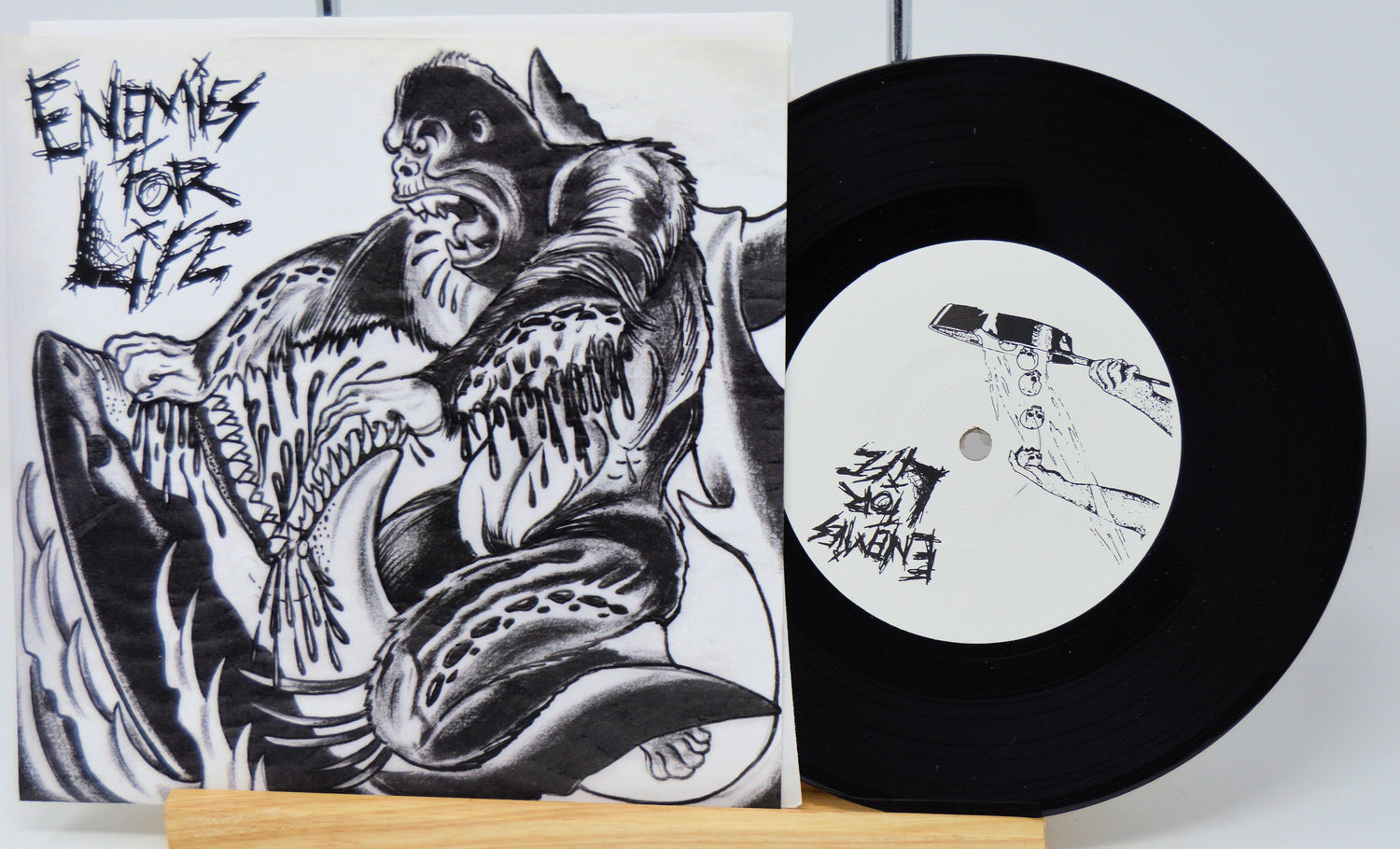 Vinyl record with a black and white illustration on the cover