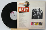 Vinyl record with its cover displaying text and images, including a black and white photo of people.