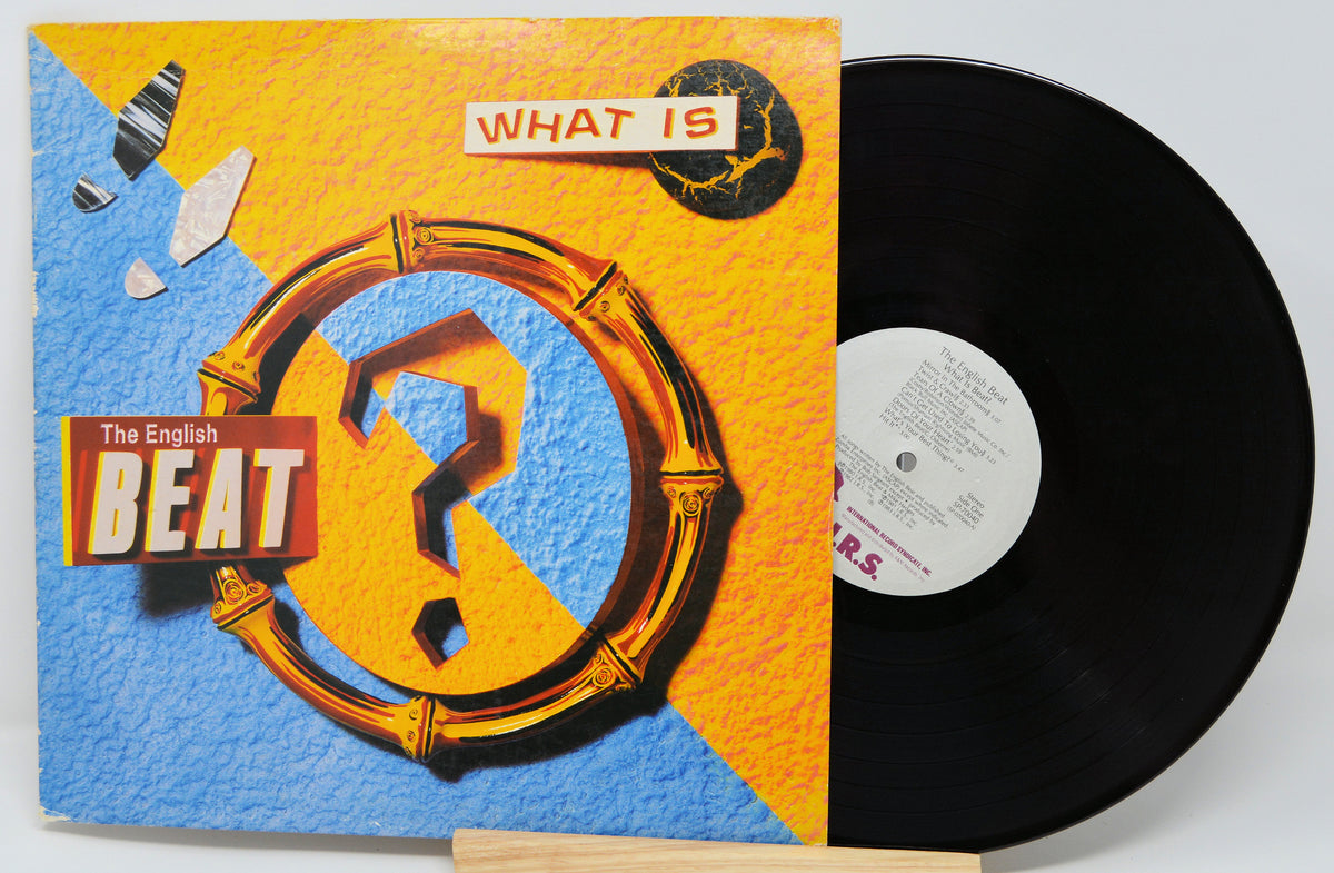 Vinyl record with 'The English Beat' album cover featuring a question mark and colorful design.
