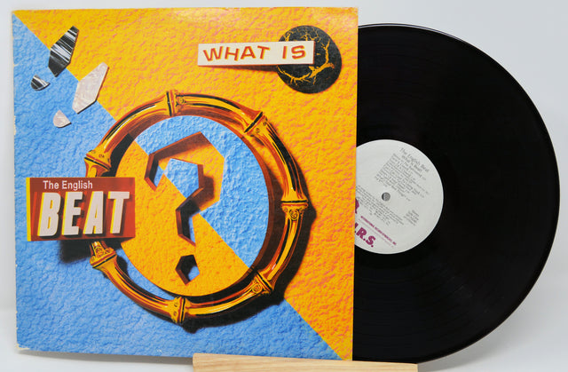Vinyl record with 'The English Beat' album cover featuring a question mark and colorful design.