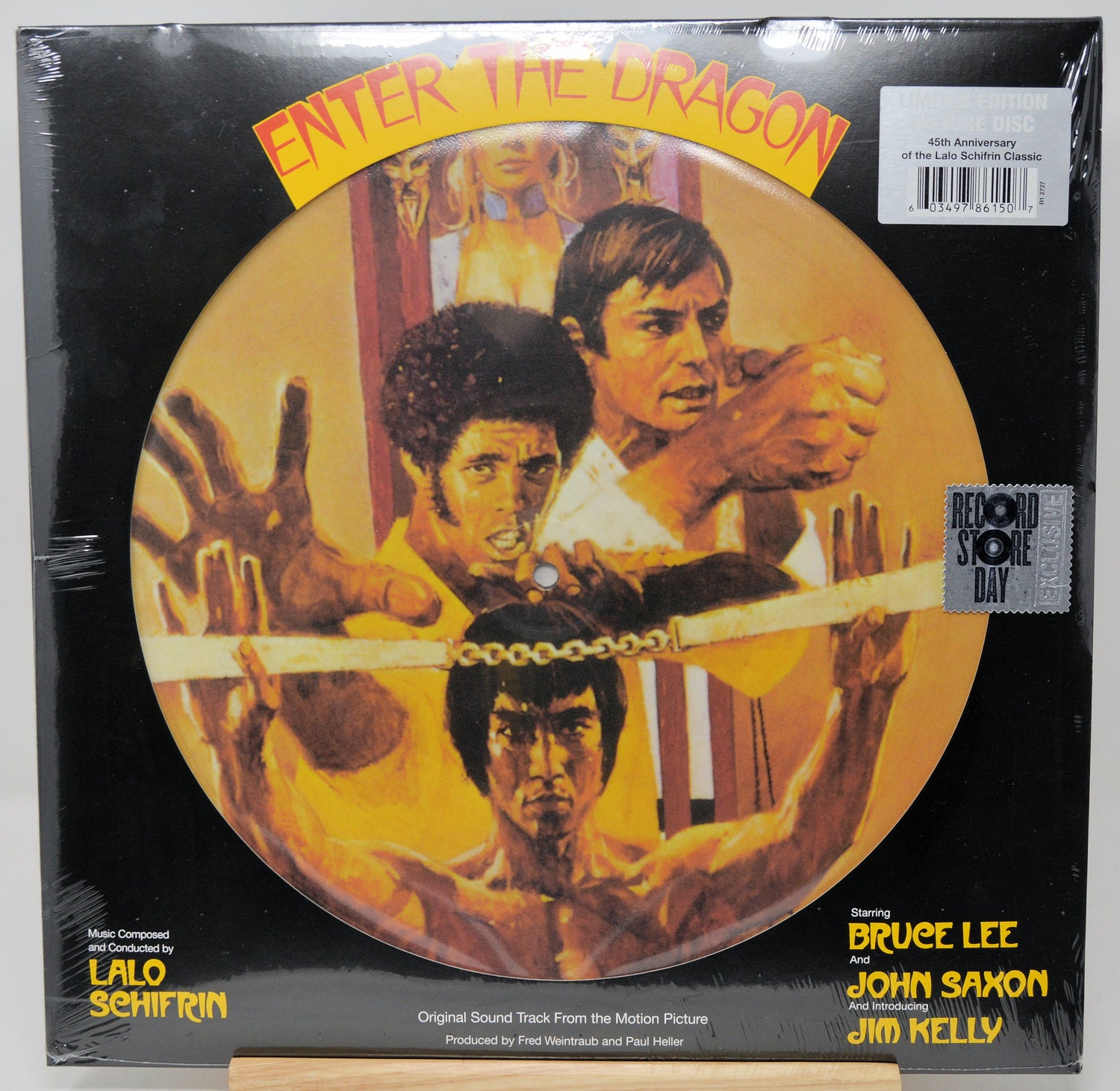 Vinyl record cover for 'Enter the Dragon' featuring Bruce Lee and John Saxon.