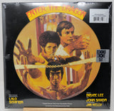 Vinyl record cover for 'Enter the Dragon' featuring Bruce Lee and John Saxon.