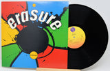 Vinyl record with colorful 'erasure' album cover on a white background