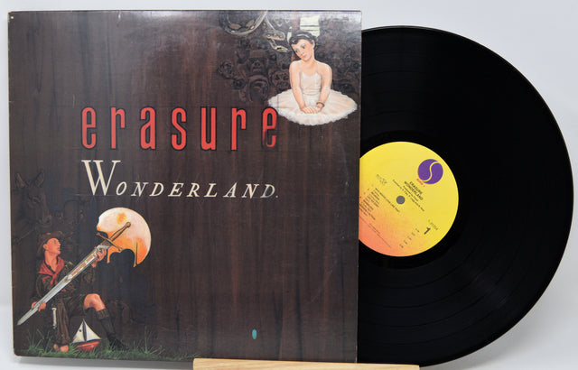 Vinyl record with 'erasure Wonderland' album cover featuring artistic illustrations.