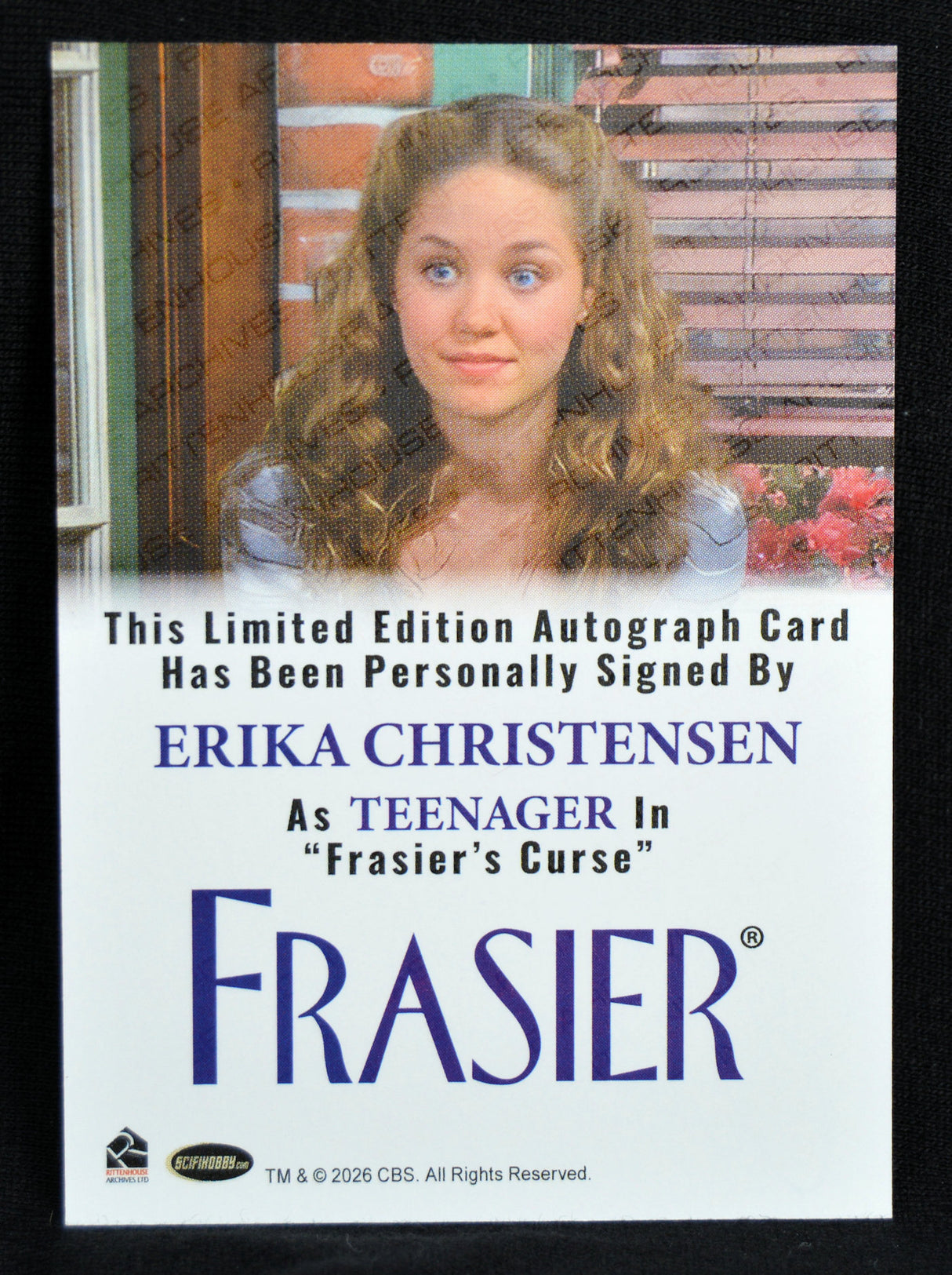 Autograph card of Erika Christensen as a teenager in 'Frasier's Curse' with a black border.