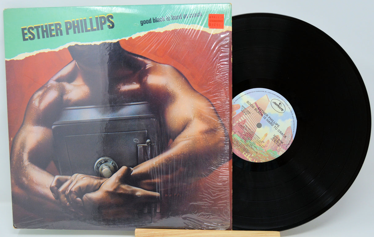 Vinyl record with cover featuring a muscular figure, 'Esther Phillips' on top.