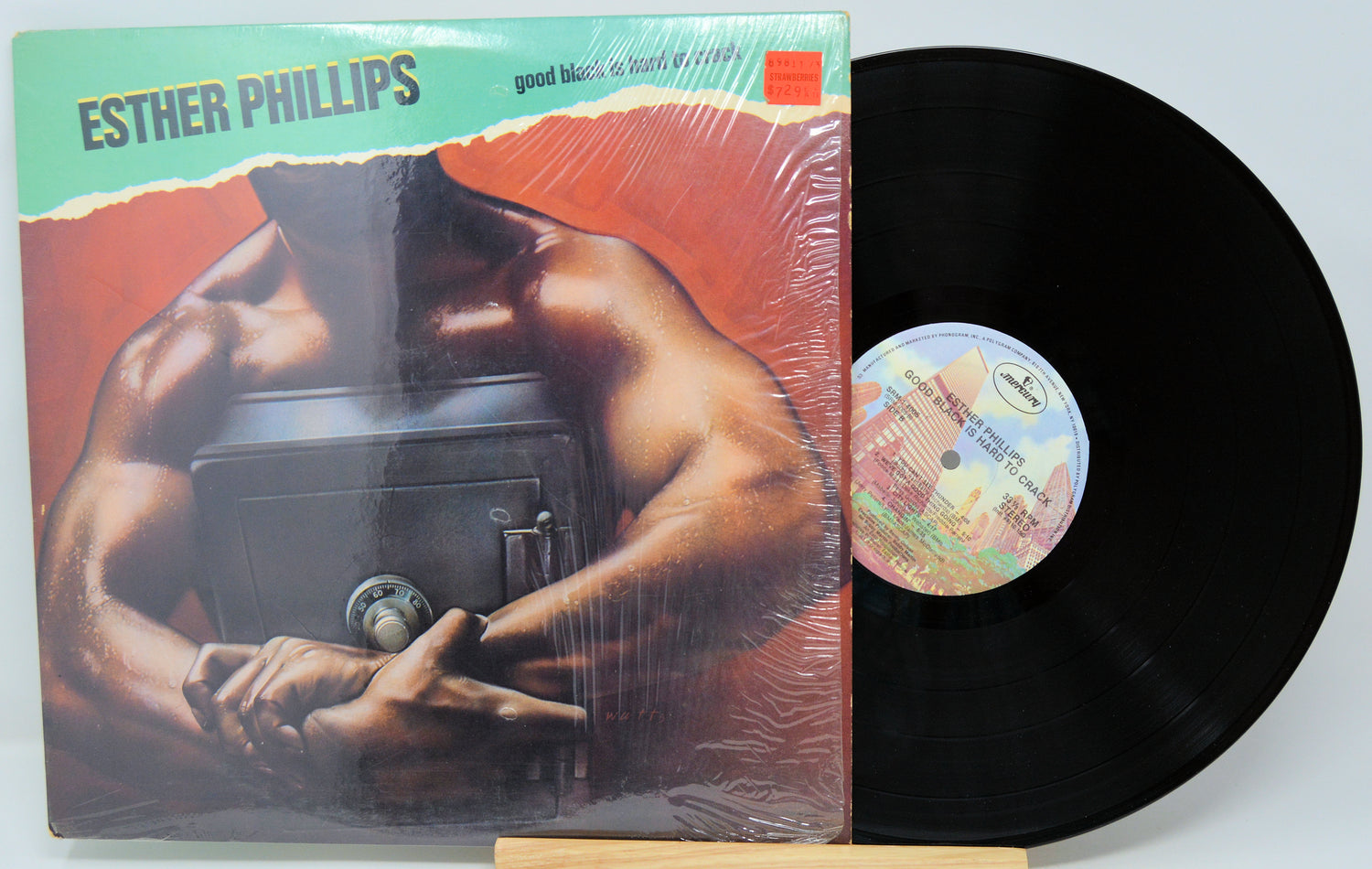 Vinyl record with cover featuring a muscular figure, 'Esther Phillips' on top.