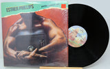 Vinyl record with cover featuring a muscular figure, 'Esther Phillips' on top.
