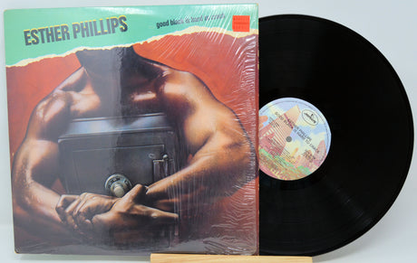 Vinyl record with cover featuring a muscular figure, 'Esther Phillips' on top.