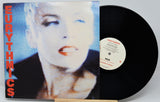 Vinyl record with Eurythmics cover featuring a close-up of a person's face.