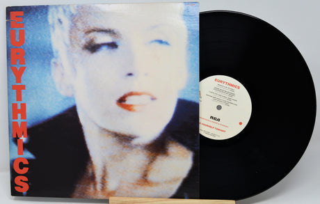 Vinyl record with Eurythmics cover featuring a close-up of a person's face.