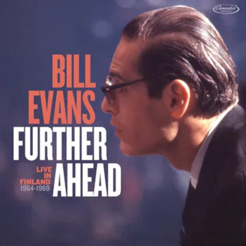 cover featuring Bill Evans looking to the side with a dark background with faint lights i the background