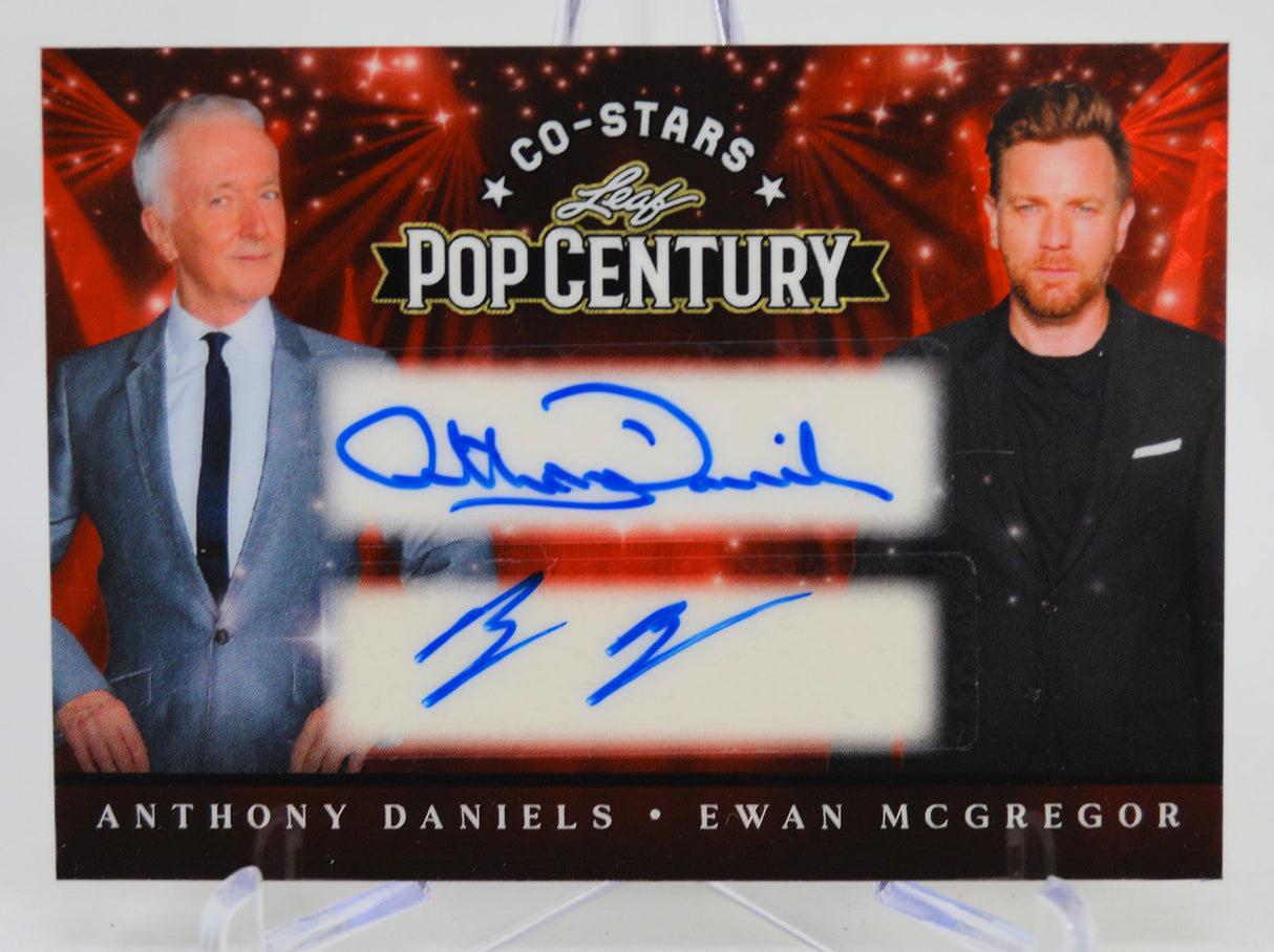 Trading card featuring Anthony Daniels and Ewan McGregor with autographs on a Pop Century background