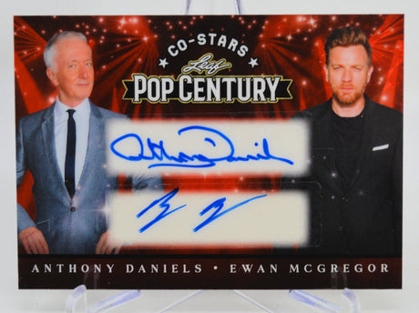Trading card featuring Anthony Daniels and Ewan McGregor with autographs on a Pop Century background