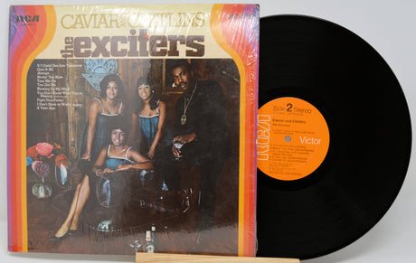 Vinyl record with cover featuring 'The Exciters' on a white background