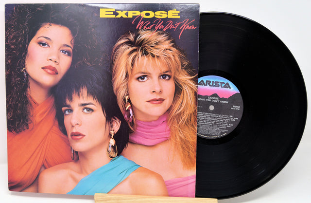 Vinyl record with 'Exposé' album cover featuring three women on a white background