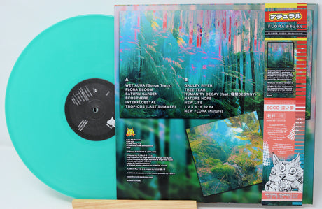 FLORA ナチュラル Flower Bloom Remastered vinyl rear cover with teal record and lush forest artwork