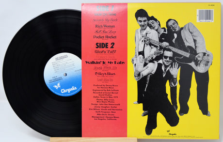 Vinyl record with cover featuring a band on a yellow background