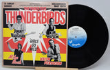 Vinyl record with cover featuring 'The Fabulous Thunderbirds' band members on a white background