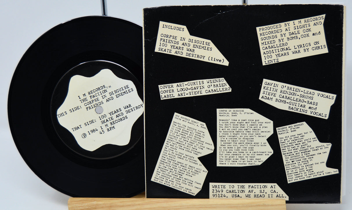 Vinyl record with a black cover featuring white text and labels.