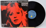 Vinyl record with cover featuring a red and black portrait of a woman, titled 'Marianne Faithfull'.