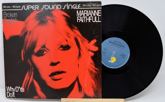 Vinyl record with cover featuring a red and black portrait of a woman, titled 'Marianne Faithfull'.