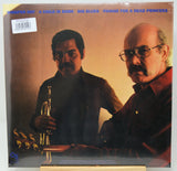 Vinyl record album cover for 'A Child Is Born Big Blues Pavane For A Dead Princess' featuring two men, one holding a trumpet. The cover has blue text at the top and a barcode sticker in the upper left corner.