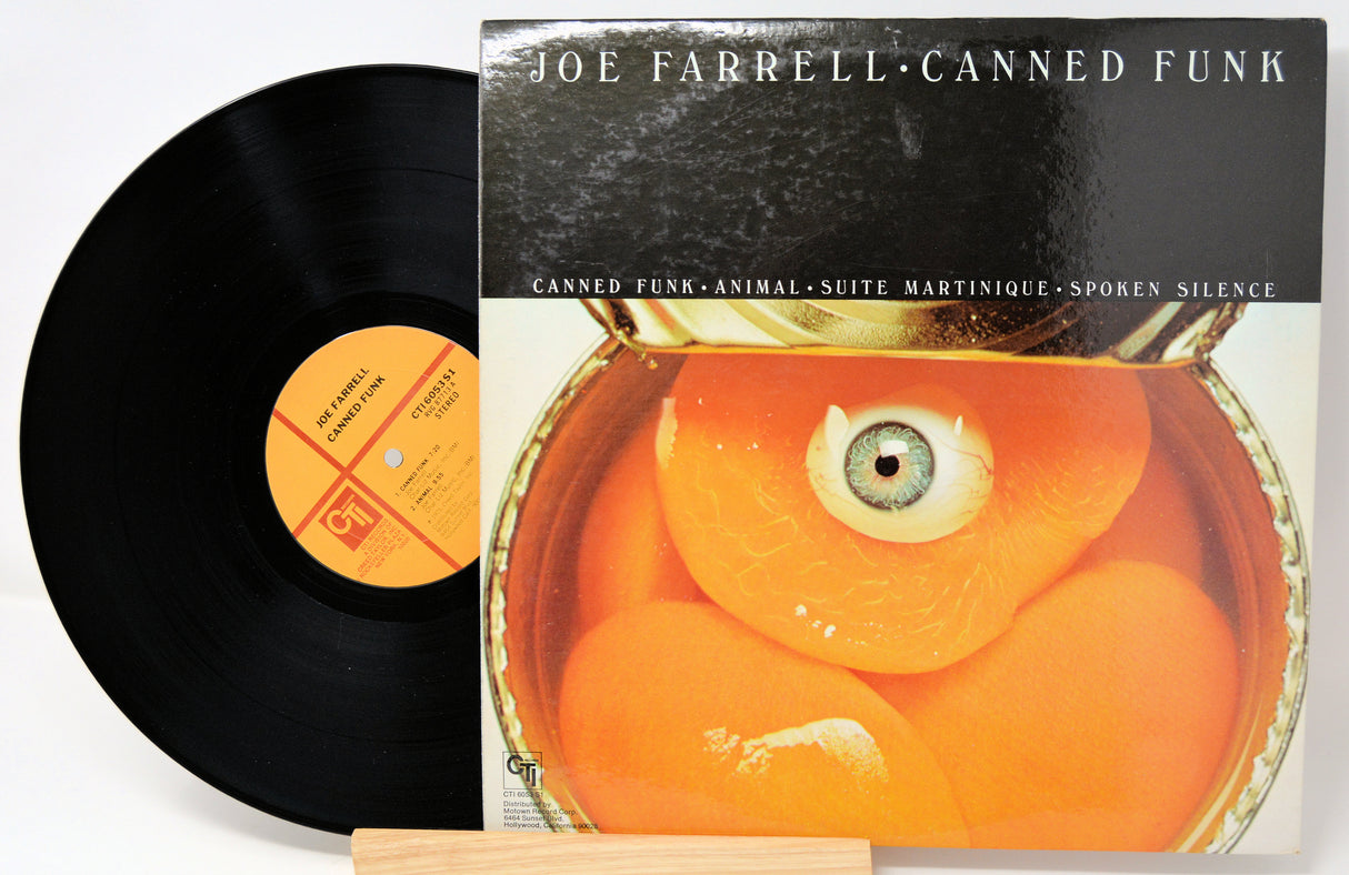 Vinyl record and cover with an eye design on a white background