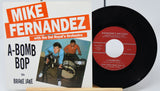 Vinyl record and cover with 'Mike Fernandez' and 'A-Bomb Bop' text on a white background