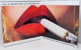 Close-up of bold red lips with a lit cigarette and provocative film noir text.